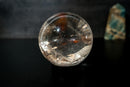 AAA Water - Clear Lemurian Quartz Sphere with Rainbows – Diamantina (3.5 in) - E2D Crystals & Minerals