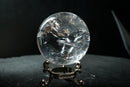 Water-Clear Quartz Sphere with Vivid Rainbows & Leaf-Shaped Feather Inclusions – Diamantina, Brazil (71 mm | 460 g) - E2D Crystals & Minerals