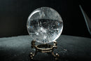 Water-Clear Quartz Sphere with Vivid Rainbows & Leaf-Shaped Feather Inclusions – Diamantina, Brazil (71 mm | 460 g) - E2D Crystals & Minerals