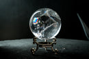 Water-Clear Quartz Sphere with Vivid Rainbows & Leaf-Shaped Feather Inclusions – Diamantina, Brazil (71 mm | 460 g) - E2D Crystals & Minerals