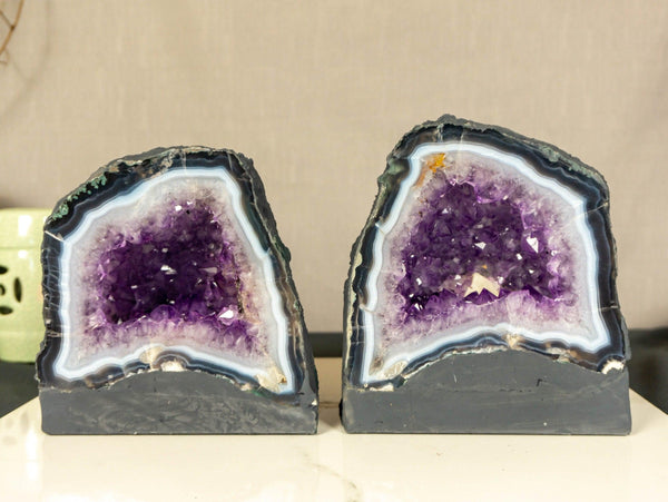 Pair of Small Purple Amethyst Cathedral Geodes on Blue Banded Agate collective